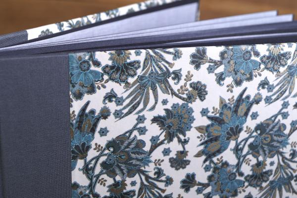 Photo album with Italian colored paper as cover and linen spine